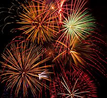 Multiple Fireworks Blasts Paint the Night Sky by Kenneth Keifer