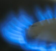 Lit blue gas ring, close-up by Sami Sarkis