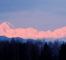 The distant Julian Alps aglow by Ian Middleton