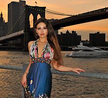 Beautiful girl posing at sunset time under Brooklyn Bridge, NYC by Anton Oparin