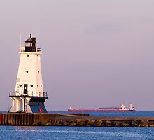 Ludington (Michigan) Light and Large Ship by Kenneth Keifer