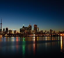 Blue Hour - Toronto's Dazzling Skyline Reflecting in Lake Ontario by Georgia Mizuleva