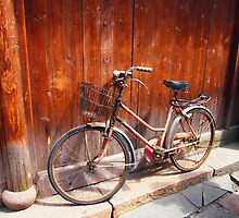 Red Bicycle, found in the water village of Wuzhen, China. by candysfamily