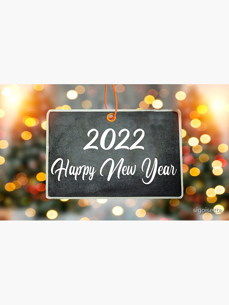 Happy New Year 2022 Concept On Handing Chalkboard With Blur Bokeh And