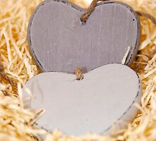 grey wooden love hearts with copy space by morrbyte