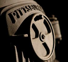 Experimenting with light and shade on my cast iron pot belly stove by John Hansen
