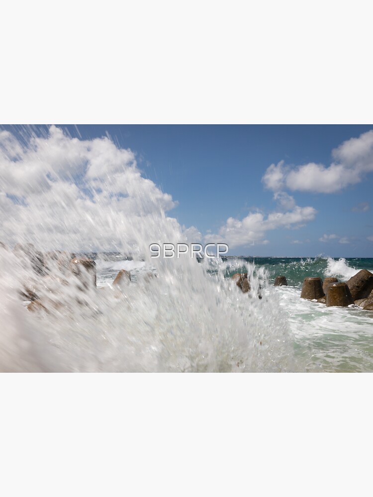 Waves Splash Against The Tetrapods Along The Sunabe Sea Wall Near