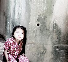 The Girl in the Red Pyjamas Dreams against a Stone Wall by Kristi Bryant