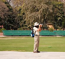 A tourist using a high powered camera inside the Red Fort in New Delhi, India by ashishagarwal74