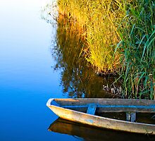 Lone boat by Valerii Baryspolets
