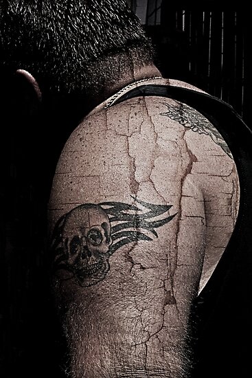 Man with skull tattoo on his arm by JaguarSunOne