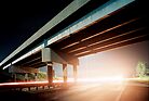 Car gliding under the highway by agenttomcat