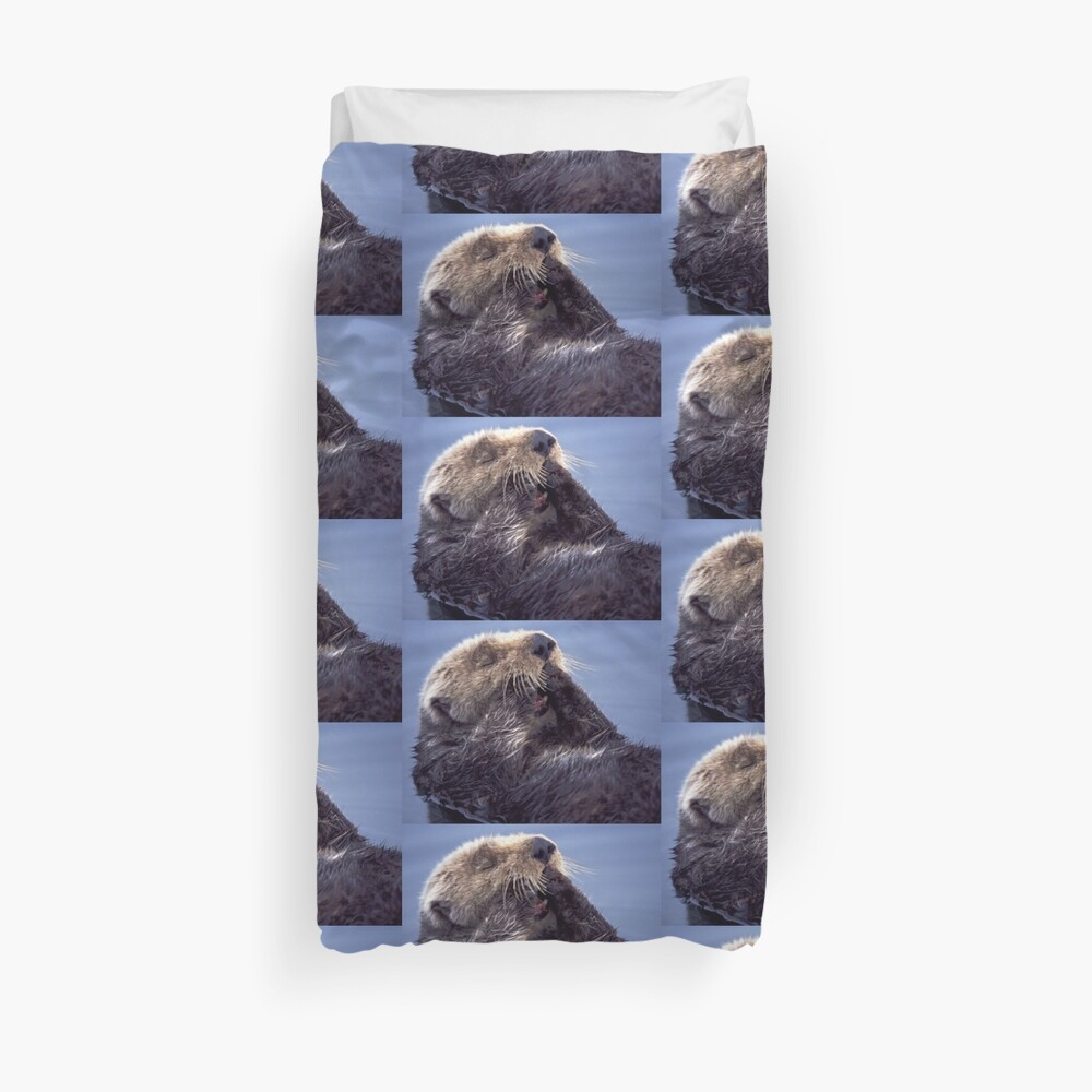 A Southern Sea Otter, preening as it wakes from a nap. Duvet Cover