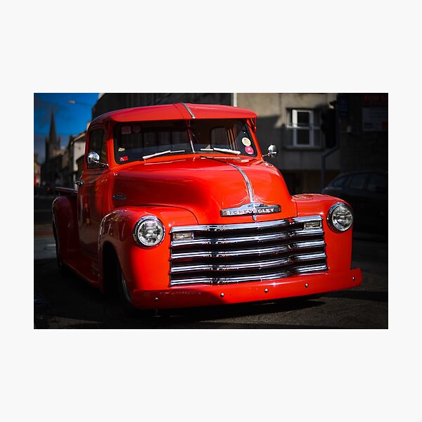 Red Chevrolet In The Street Photographic Print