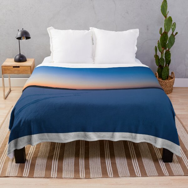 Item preview, Frozen ice lake in winter under the snowy covered under a blue sky at dawn designed and sold by yarvin13.