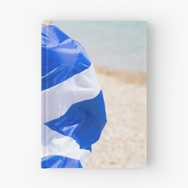 Item preview, A young man holding the flag of Scotland designed and sold by Ben Gingell.
