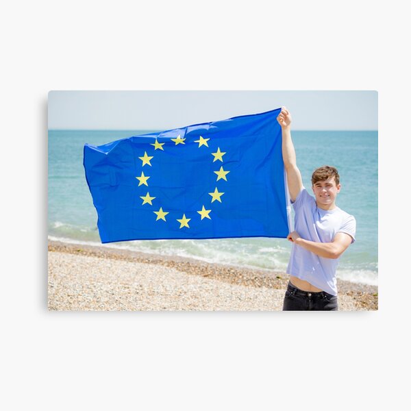 A young man holding the flag of The European Union Canvas Print