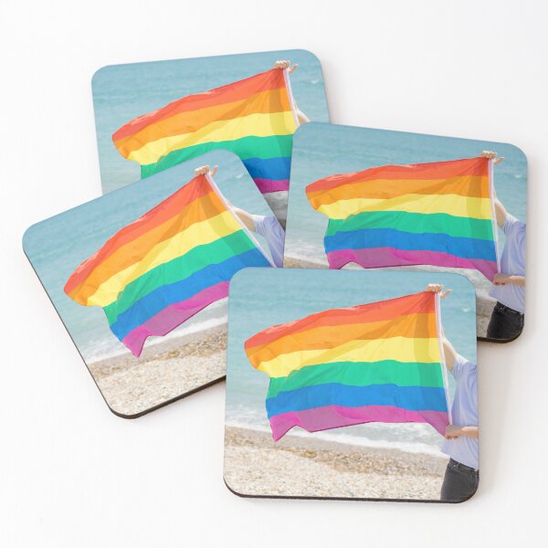 Item preview, A young man holding a Pride flag designed and sold by Ben Gingell.