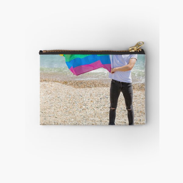 Item preview, A young man holding a Pride flag designed and sold by Ben Gingell.