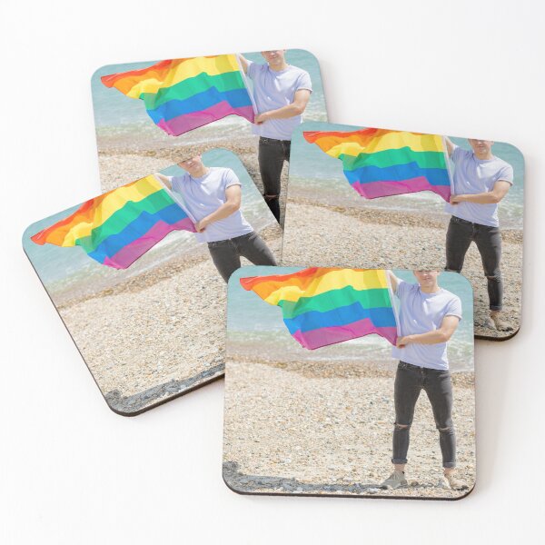 Item preview, A young man holding a Pride flag designed and sold by Ben Gingell.