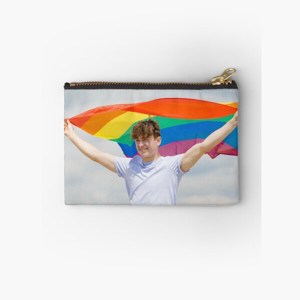 Item preview, A young man holding a Pride flag designed and sold by Ben Gingell.