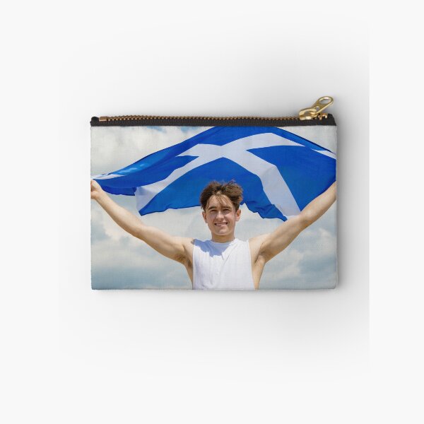 Item preview, A young man holding the flag of Scotland designed and sold by Ben Gingell.