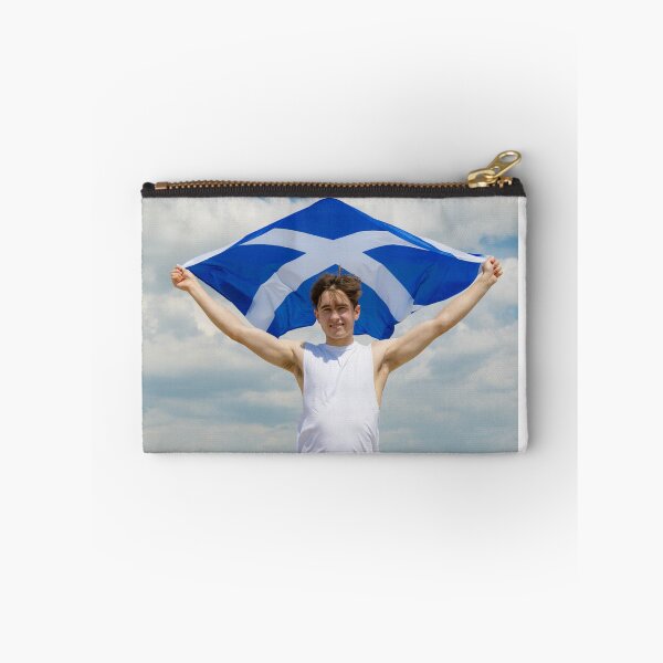 Item preview, A young man holding the flag of Scotland designed and sold by Ben Gingell.