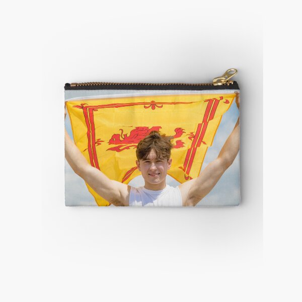Item preview, A young man holding the Lion Rampant flag of Scotland designed and sold by Ben Gingell.