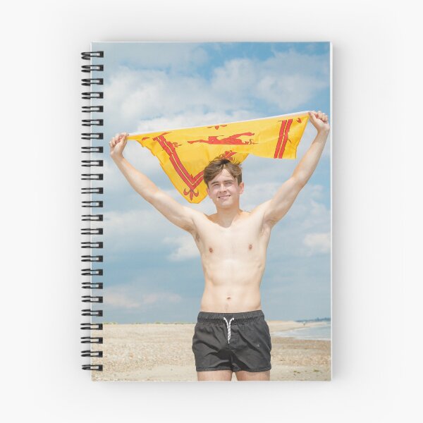 Item preview, A shirtless young man holding the Scottish Lion Rampant flag designed and sold by Ben Gingell.