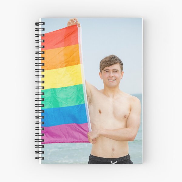Item preview, A shirtless young man holding the Pride flag designed and sold by Ben Gingell.