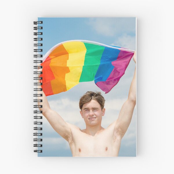 Item preview, A shirtless young man holding the Pride flag designed and sold by Ben Gingell.