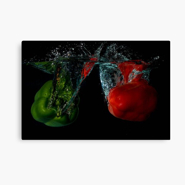 Green and Red Bell Sweet Peppers Dropped Into Water Canvas Print