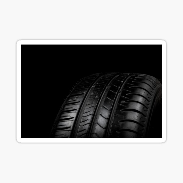 Car tyre isolated on a black background Sticker