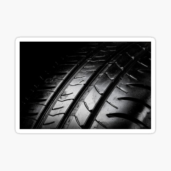 Car tyre isolated on a black background Sticker