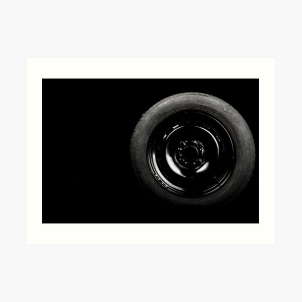 Close up view of car tyre isolated on a black background Art Print
