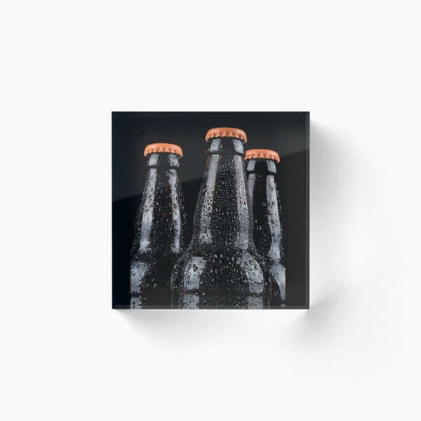 Bottles of beer with water droplets isolated on black background Acrylic Block