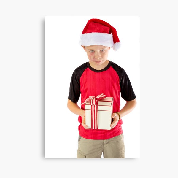 Pre-teen boy with a christmas gift Canvas Print