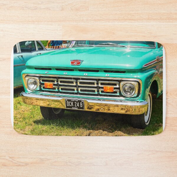 Item preview, The front of a turquoise 1964 Ford F100 Fleetside on display at a car show designed and sold by Graham Cornall.