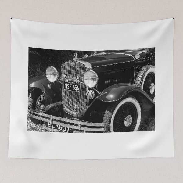 Item preview, A black and white image of the front of a 1931 Chevrolet sedan on display at a car show designed and sold by Graham Cornall.