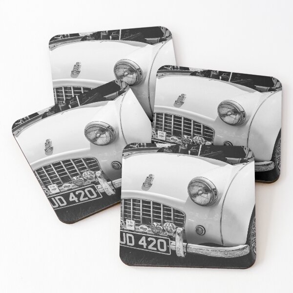 Item preview, A black and white image of the front of a 1950's Triumph TR3 on display at a car show designed and sold by Graham Cornall.