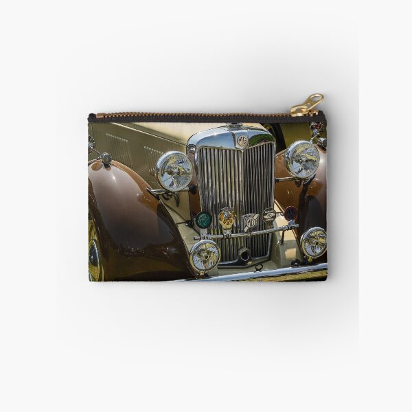 Item preview, The front of a brown and cream 1952 MG TD roadster on display at a car show designed and sold by Graham Cornall.