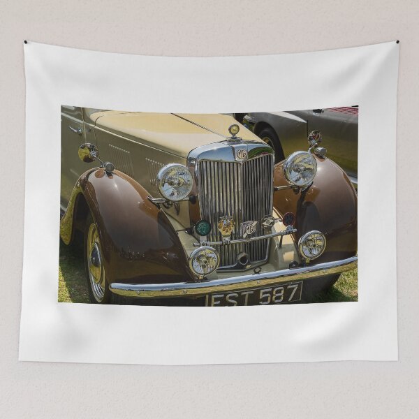 Item preview, The front of a brown and cream 1952 MG TD roadster on display at a car show designed and sold by Graham Cornall.