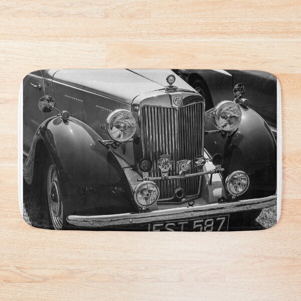 Item preview, A black and white image of the front of a 1952 MG TD roadster on display at a car show designed and sold by Graham Cornall.