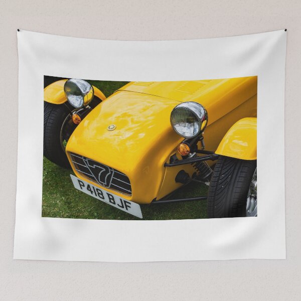 Item preview, The front of a yellow 1996 Caterham Super 7 on display at a car show designed and sold by Graham Cornall.