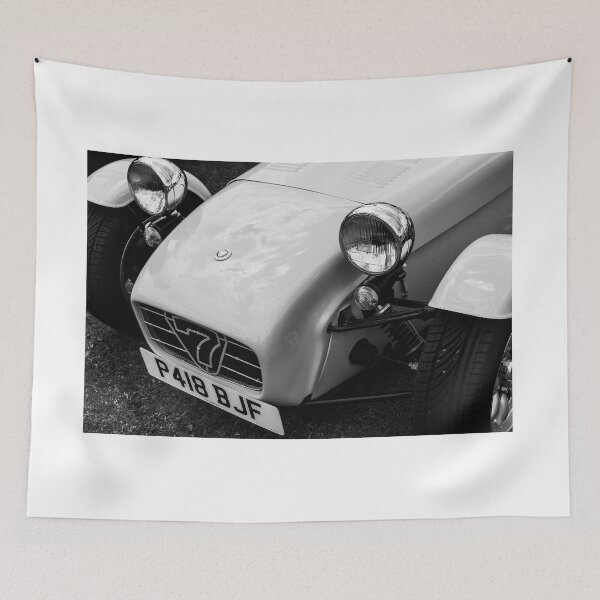 Item preview, A black and white image of the front of a 1996 Caterham Super 7 on display at a car show designed and sold by Graham Cornall.