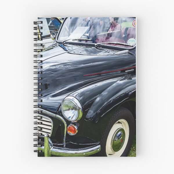 Item preview, The front of a black 1967 Morris Minor Traveller on display at a car show designed and sold by Graham Cornall.