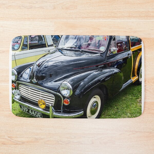 Item preview, The front of a black 1967 Morris Minor Traveller on display at a car show designed and sold by Graham Cornall.