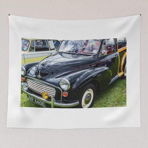 Item preview, The front of a black 1967 Morris Minor Traveller on display at a car show designed and sold by Graham Cornall.