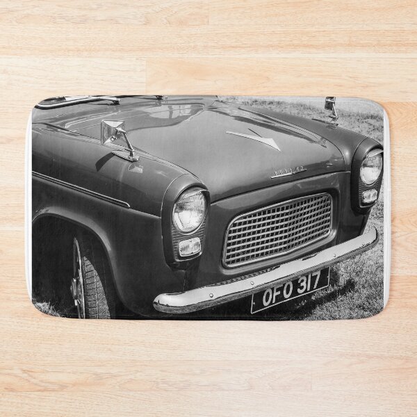 Item preview, A black and white image of the front of a grey 1961 Ford Popular on display at a car show designed and sold by Graham Cornall.