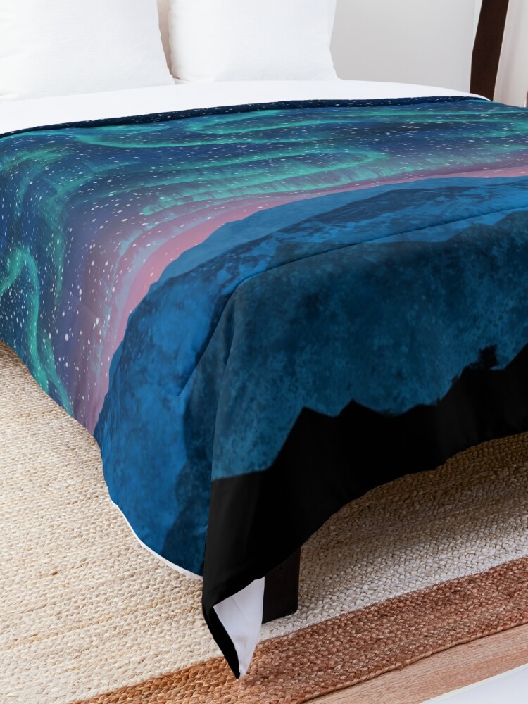 Alternate view of Aurora borealis over mountains Comforter